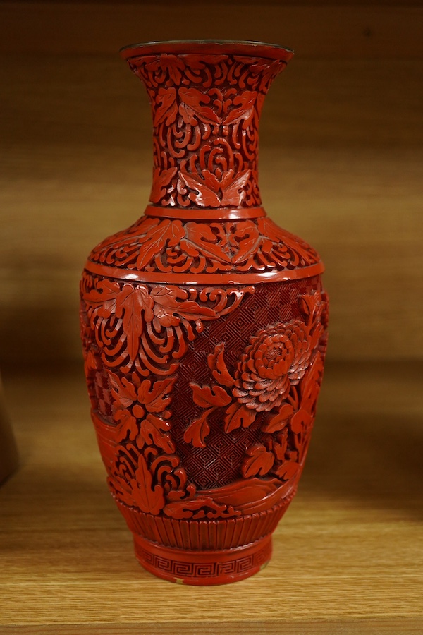 A Chinese red lacquered vase, 25.5cm. Condition - good